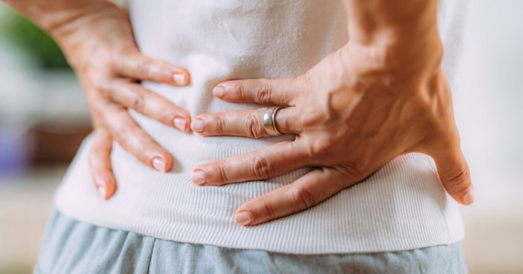 close-up-of-hands-on-lower-back-showing-discomfort-of-herniated-disc