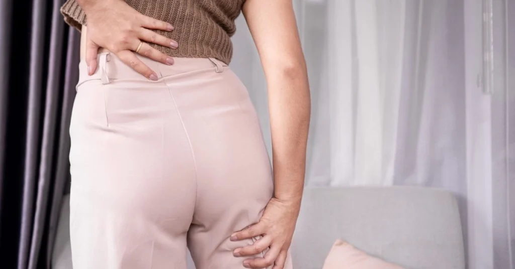 woman-experiencing-sciatica-pain-holding-lower-back-and-leg