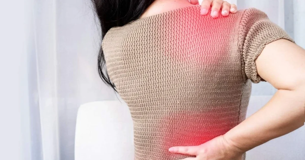 woman-with-chronic-shoulder-and-back-pain-receiving-guidance-from-loucil-chiropractic-in-ives-estates-highlighting-treatment-by-a-neck-pain-chiropractor
